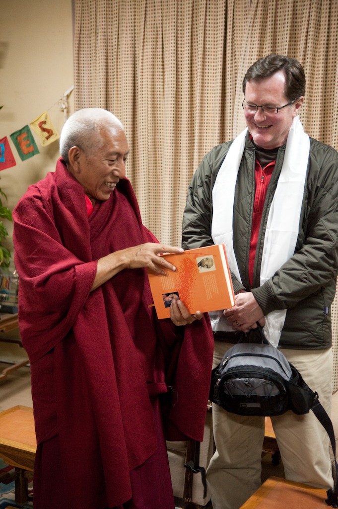 Professor Deane Curtin (right) receives a gift from former Prime Minister Professor Venerable Samdhong Rinpoche.