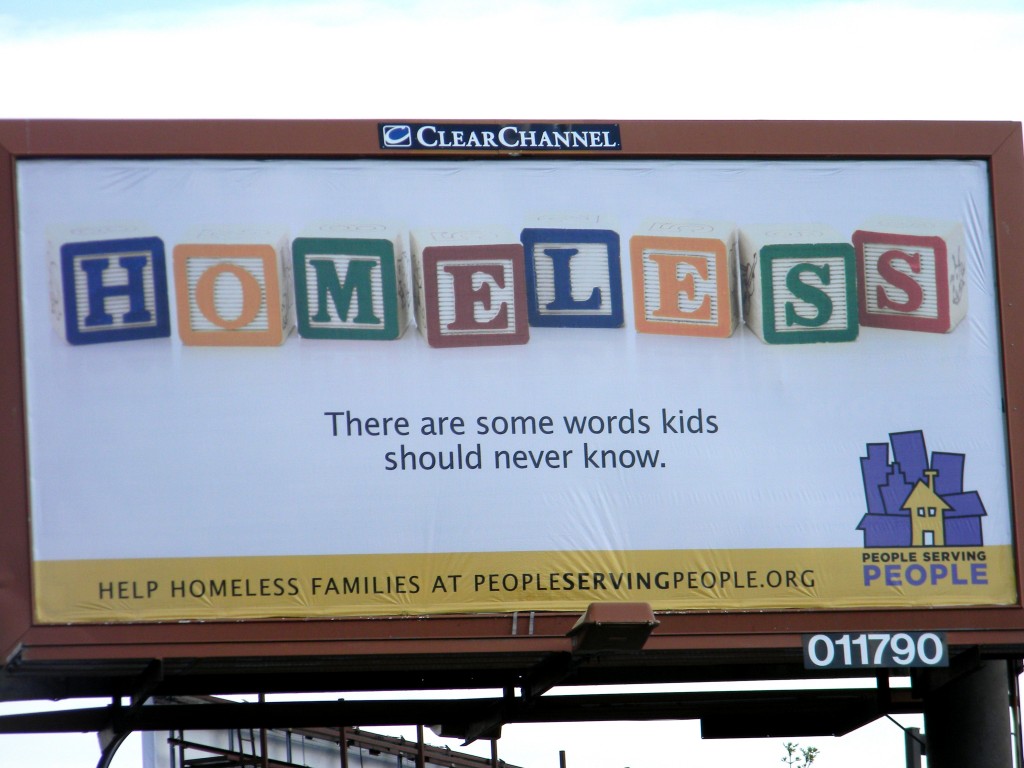 This billboard sits at the intersection of 3rd Street and Portland Avenue in Minneapolis, just outside the People Serving People shelter.